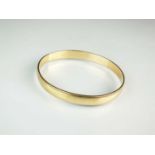 A 9ct gold plain polished bangle