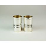 A pair of modern silver beakers