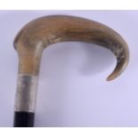 A 19TH CENTURY CONTINENTAL CARVED RHINOCEROS HORN HANDLED WALKING CANE with silver mounts. 83 cm lon