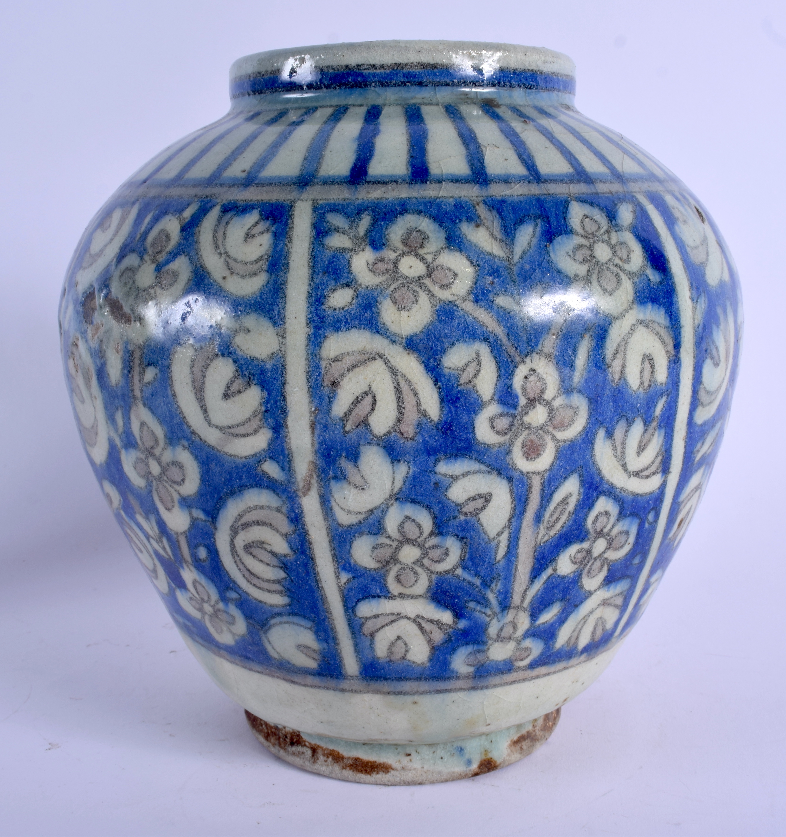AN EARLY 20TH CENTURY MIDDLE EASTERN PERSIAN FAIENCE JARLET painted with flowers and vines. 22 cm x - Image 2 of 5