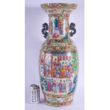 A LARGE 19TH CENTURY CHINESE CANTON FAMILLE ROSE VASE Qing, painted with figures before an official