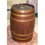 AN ANTIQUE BRASS BOUND OAK BARREL. 70 cm x 40 cm.