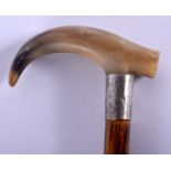 A 19TH CENTURY CONTINENTAL CARVED BUFFALO HORN WALKING CANE with silver mounts. 88 cm long.