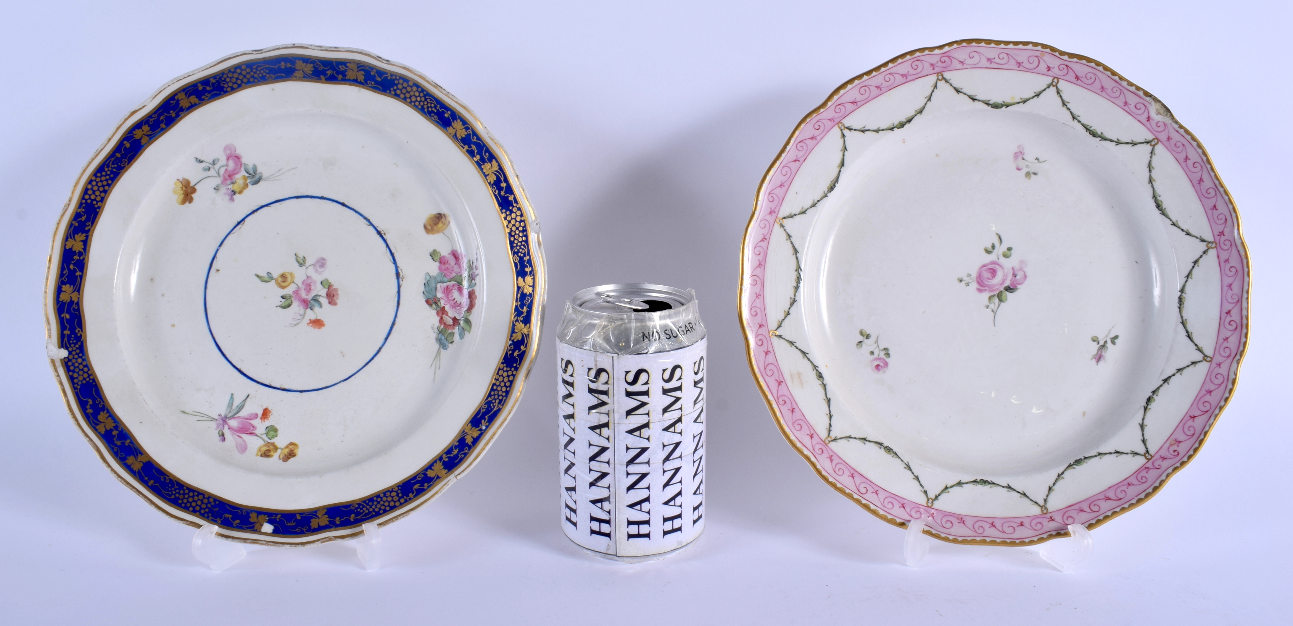 TWO 18TH CENTURY CHELSEA DERBY PORCELAIN PLATES one painted with blue, one painted with a pink borde