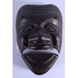 AN 18TH/19TH CENTURY JAPANESE EDO PERIOD IRON KARURA SOMEN modelled as a jovial male. 19 cm x 10 cm.