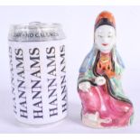 A 19TH CENTURY CHINESE FAMILLE ROSE PORCELAIN FIGURE OF GUANYIN Qing, modelled in green and pink emb