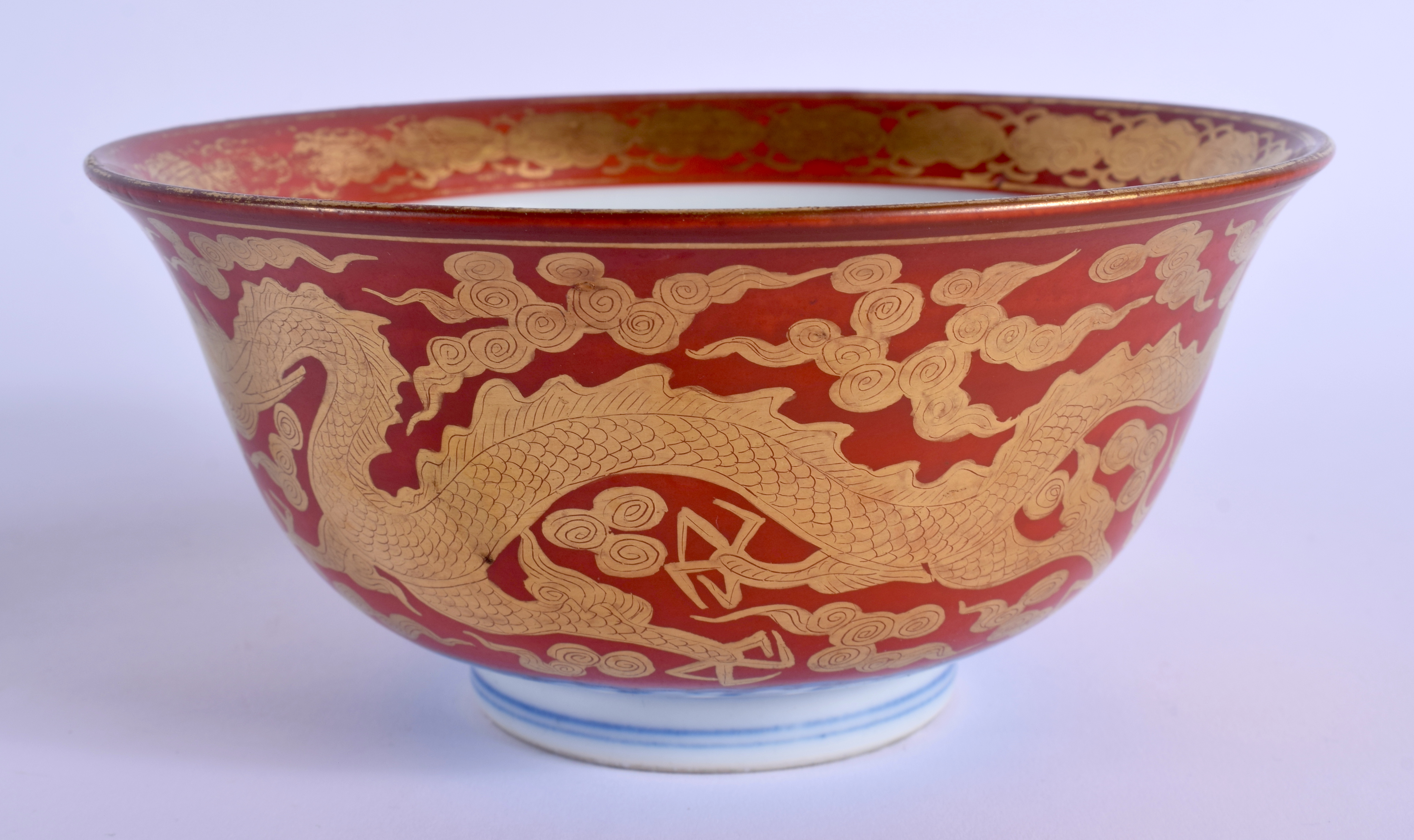 A 19TH CENTURY JAPANESE MEIJI PERIOD KUTANI PORCELAIN BOWL painted upon a coral ground with dragons. - Image 3 of 5
