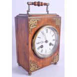 A LATE 19TH CENTURY OAK CASED MANTEL CLOCK with brass embellishments. 19 cm high.