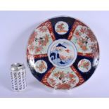 A 19TH CENTURY JAPANESE MEIJI PERIOD IMARI PORCELAIN CHARGER painted with flowers. 30 cm diameter.