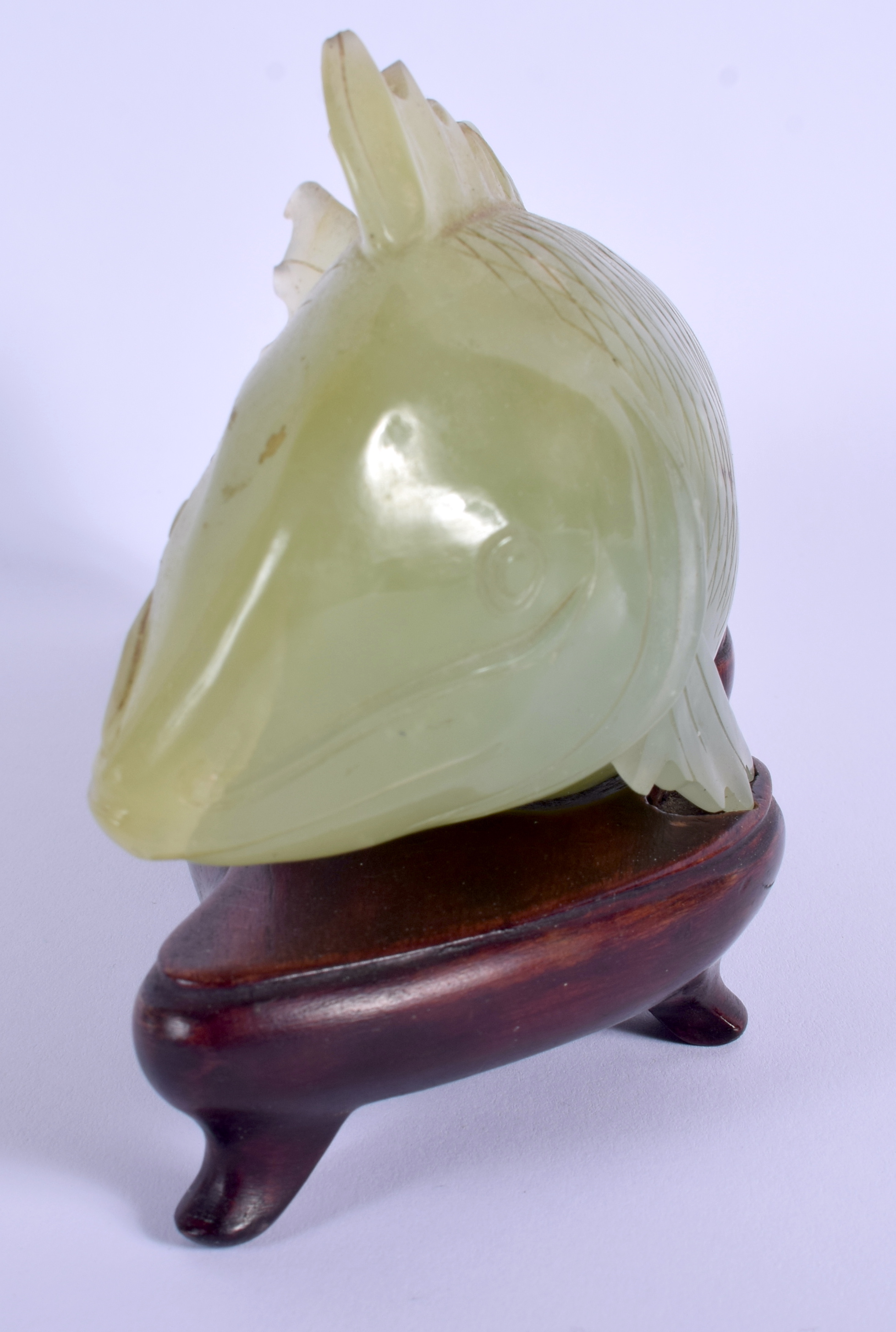 AN EARLY 20TH CENTURY CHINESE CARVED JADE FIGURE OF A FISH Late Qing, modelled upon a fitted hardwoo - Image 2 of 8