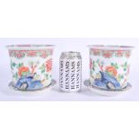 A PAIR OF 19TH CENTURY CHINESE FAMILLE ROSE JARDINIERES ON STANDS Qing, painted with flowers in the
