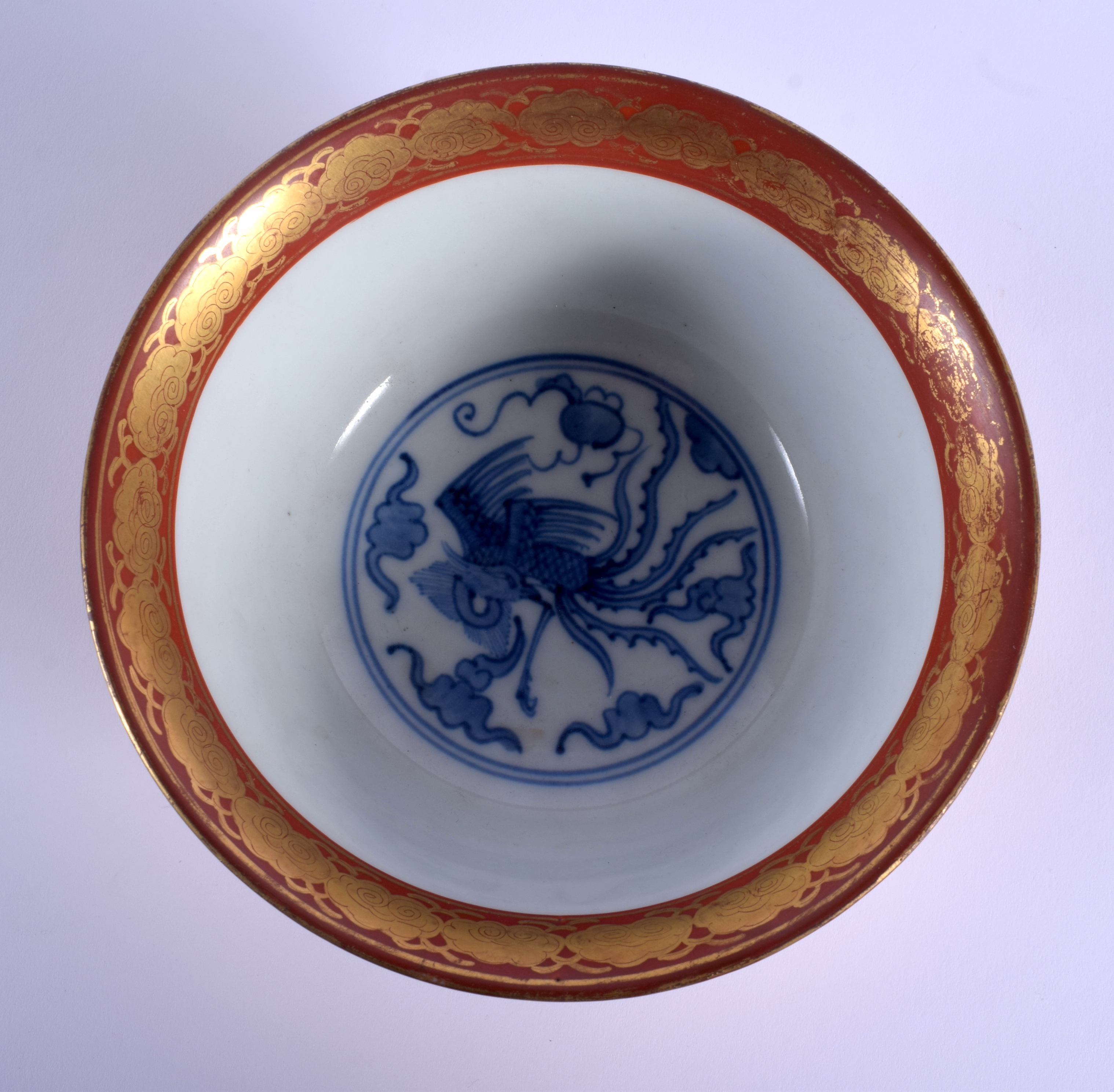 A 19TH CENTURY JAPANESE MEIJI PERIOD KUTANI PORCELAIN BOWL painted upon a coral ground with dragons. - Image 4 of 5