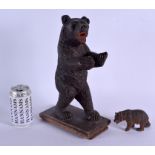 A LARGE EARLY 20TH CENTURY BAVARIAN BLACK FOREST CARVED BEAR together with another smaller bear. Lar