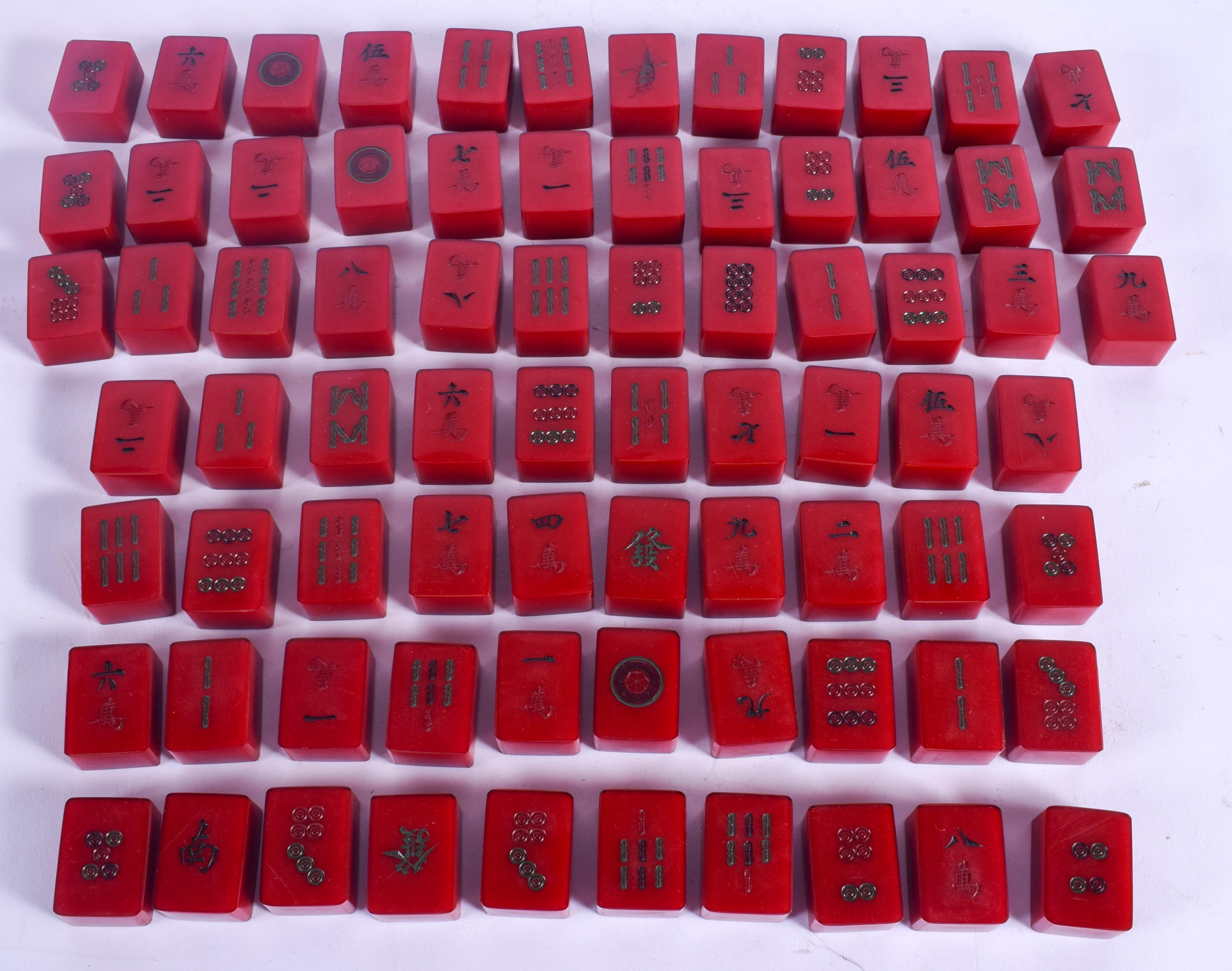 A RARE SET OF ART DECO CATALIN BAKELITE MAH-JONG SET of cherry red colour. (76 pieces)