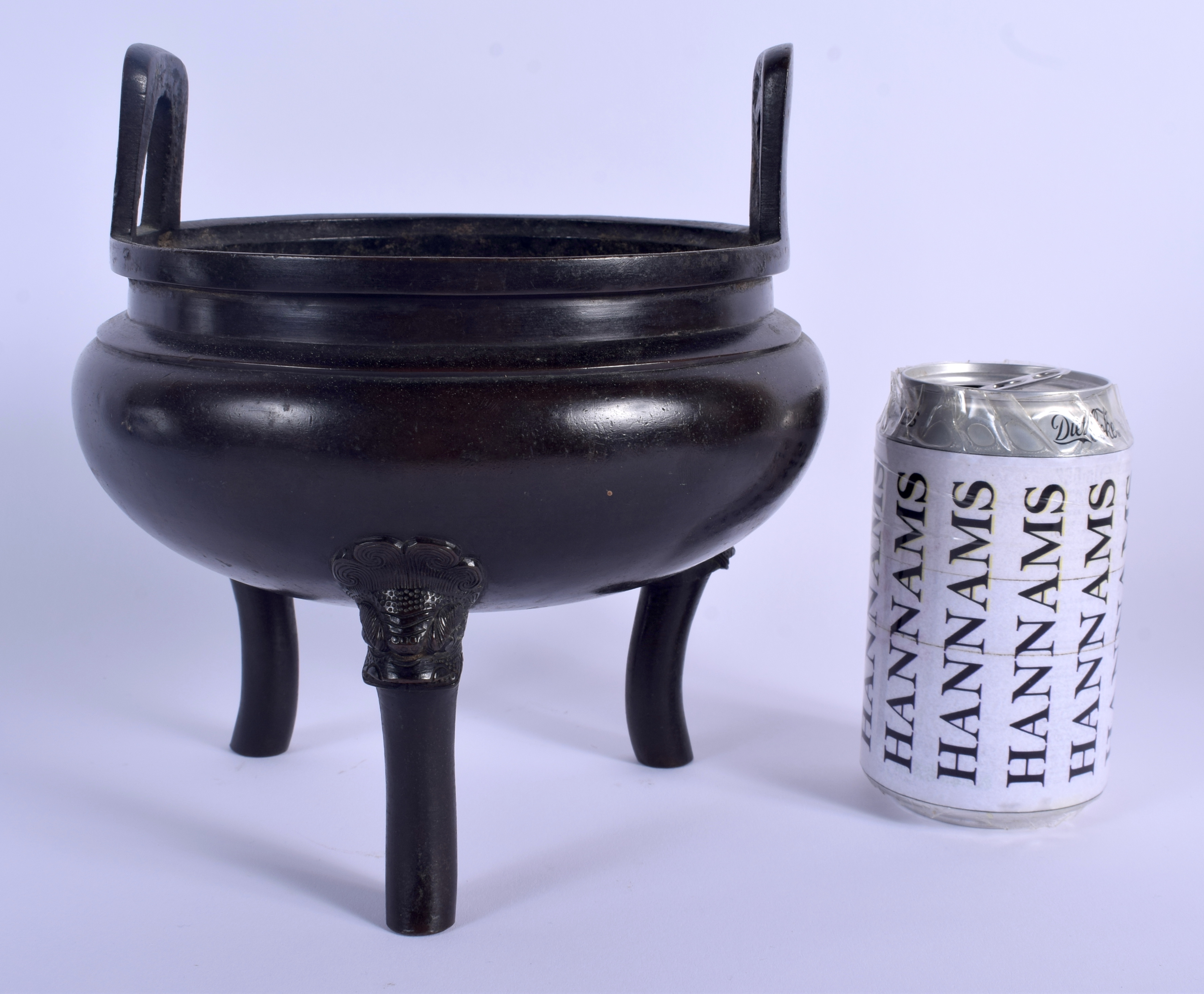 A 19TH CENTURY CHINESE TWIN HANDLED BRONZE CENSER Qing, bearing Xuande marks to base. 17 cm x 19 cm.
