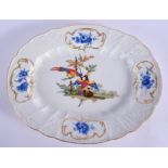 AN 18TH CENTURY MEISSEN PORCELAIN LEAF AND VINE MOULDED PORCELAIN DISH painted with exotic birds wit