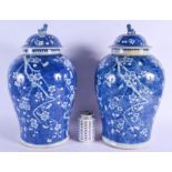 A LARGE PAIR OF 19TH CENTURY CHINESE BLUE AND WHITE PORCELAIN GINGER JARS AND COVERS Kangxi style, p