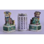 A PAIR OF 17TH/18TH CENTURY CHINESE BISCUIT GLAZED FAMILLE VERTE BUDDHISTIC LIONS Kangxi, painted wi