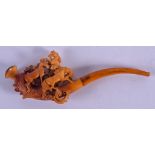 A 19TH CENTURY CARVED MEERSCHAUM AND AMBER PIPE formed as three roaming horses. 18 cm wide.