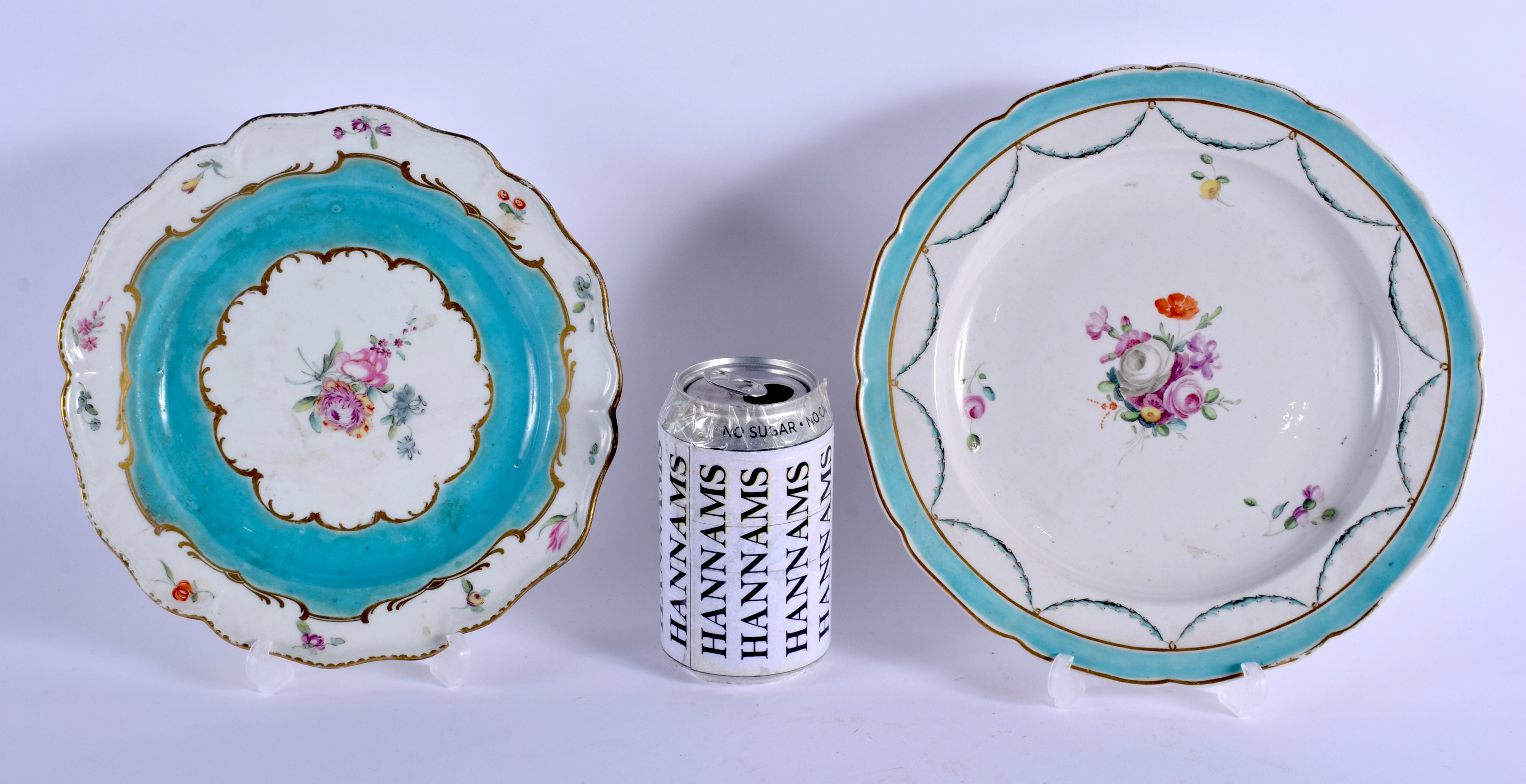 TWO 18TH CENTURY CHELSEA DERBY PORCELAIN PLATES painted upon a turquoise blue border. Largest 22 cm