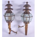 A PAIR OF REGENCY STYLE BRASS AND STAR GLASS LANTERNS of hexagonal form. 55 cm long.