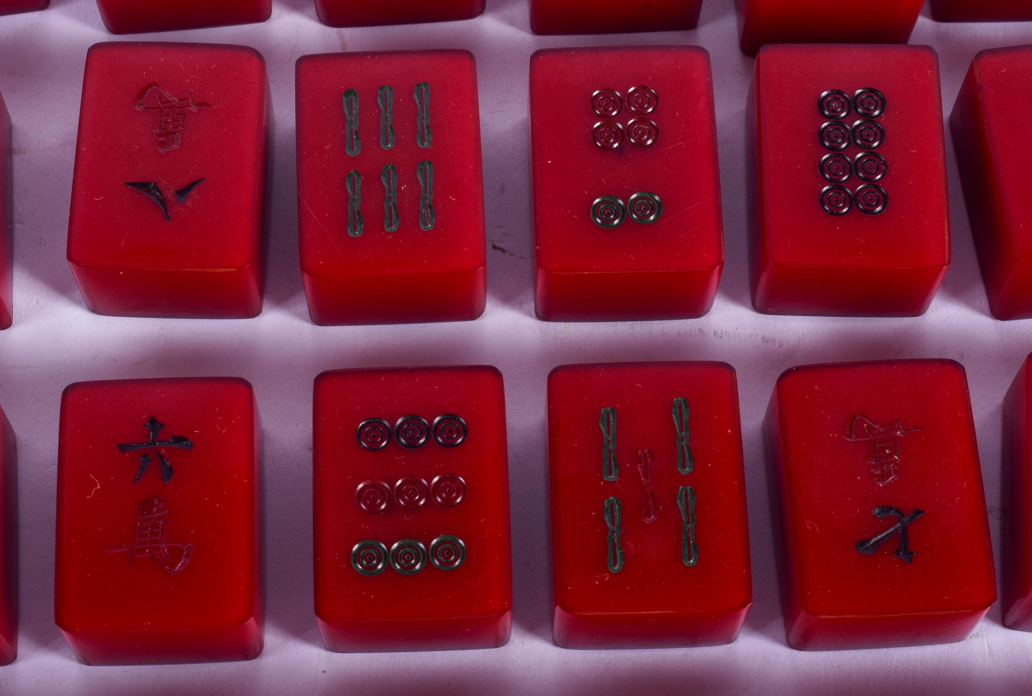 A RARE SET OF ART DECO CATALIN BAKELITE MAH-JONG SET of cherry red colour. (76 pieces) - Image 3 of 6