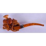 A 19TH CENTURY CARVED MEERSCHAUM AND AMBER PIPE formed as vines and leaves. 16.5 cm wide.