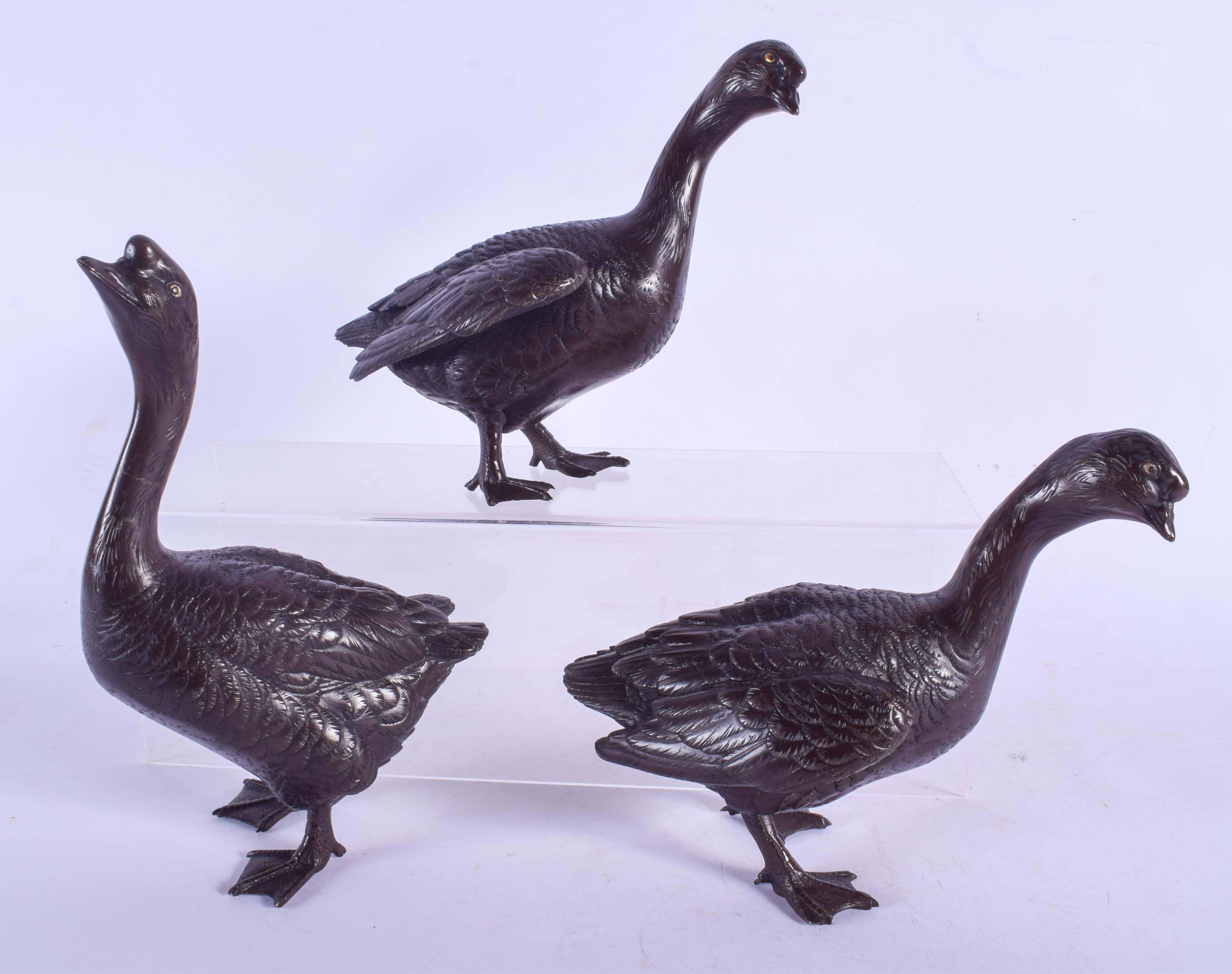 A RARE SET OF THREE 19TH CENTURY JAPANESE MEIJI PERIOD BRONZE GEESE in the manner of Kano Seiun (Bor