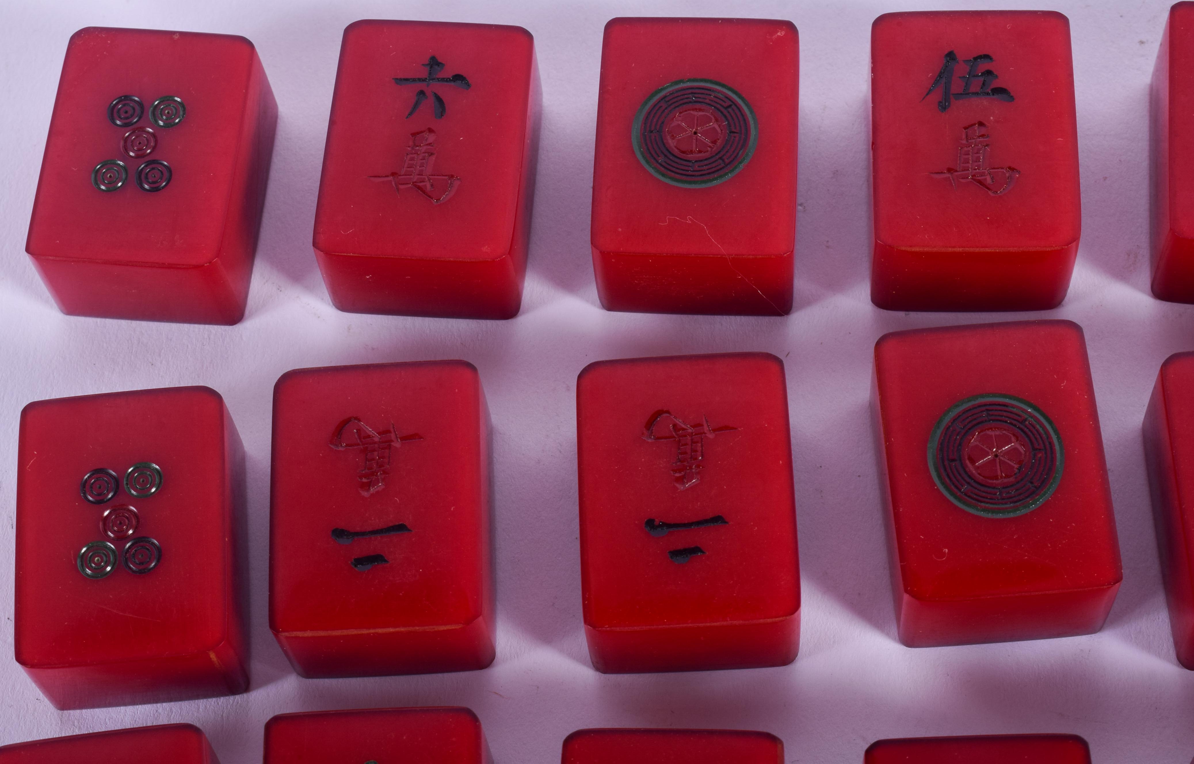 A RARE SET OF ART DECO CATALIN BAKELITE MAH-JONG SET of cherry red colour. (76 pieces) - Image 2 of 6