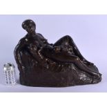 A VERY EARLY 1920S EUROPEAN BRONZE FIGURE OF A RECLINING LADY by S Jarey, modelled as a sleeping chi