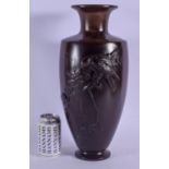 A LARGE 19TH CENTURY JAPANESE MEIJI PERIOD BRONZE VASE decorated with a hawk perched upon flowering