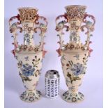 A LARGE PAIR OF ANTIQUE HUNGARIAN FISCHER POTTERY TWIN HANDLED VASES decorated with flowers. 39 cm h