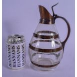 AN ARTS AND CRAFTS COPPER AND CRYSTAL GLASS WHISKEY DECANTER of barrel form. 24.5 cm high.