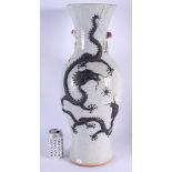 A LARGE 19TH CENTURY CHINESE CRACKLE GLAZED PORCELAIN VASE Qing, carved with dragons in various purs