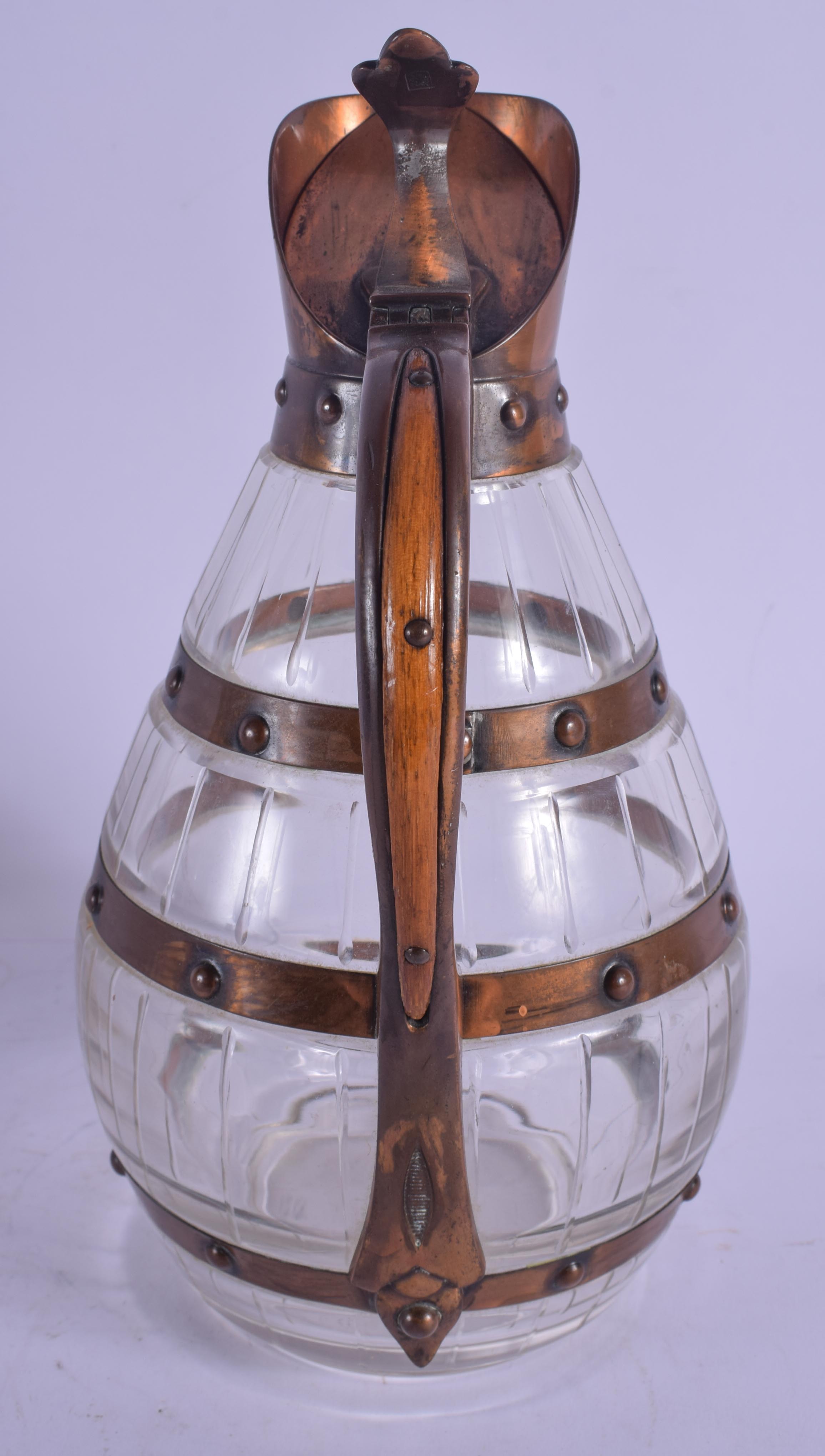 AN ARTS AND CRAFTS COPPER AND CRYSTAL GLASS WHISKEY DECANTER of barrel form. 24.5 cm high. - Image 2 of 4