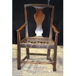 A GEORGE II CARVED WOOD SINGLE DINING CHAIR with shaped backsplat and tactile scrolling front suppor