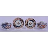 A PAIR OF 19TH CENTURY JAPANESE MEIJI PERIOD IMARI BOWLS AND COVERS painted with floral sprays. 10 c