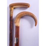 TWO 19TH CENTURY CONTINENTAL CARVED RHINOCEROS HORN HANDLED WALKING CANES. 88 cm long. (2)