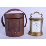 A LEATHER CASED 19TH CENTURY FRENCH BRASS OVAL REPEATING CARRIAGE CLOCK retailed by Edwards & Sons o