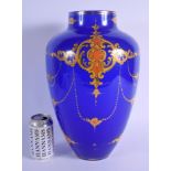 A LARGE TURKISH OTTOMAN BLUE GLASS VASE enamelled with motifs. 39 cm x 18 cm.