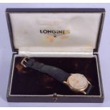 A BOXED 9CT GOLD LONGINES WRISTWATCH. 3.25 cm wide.