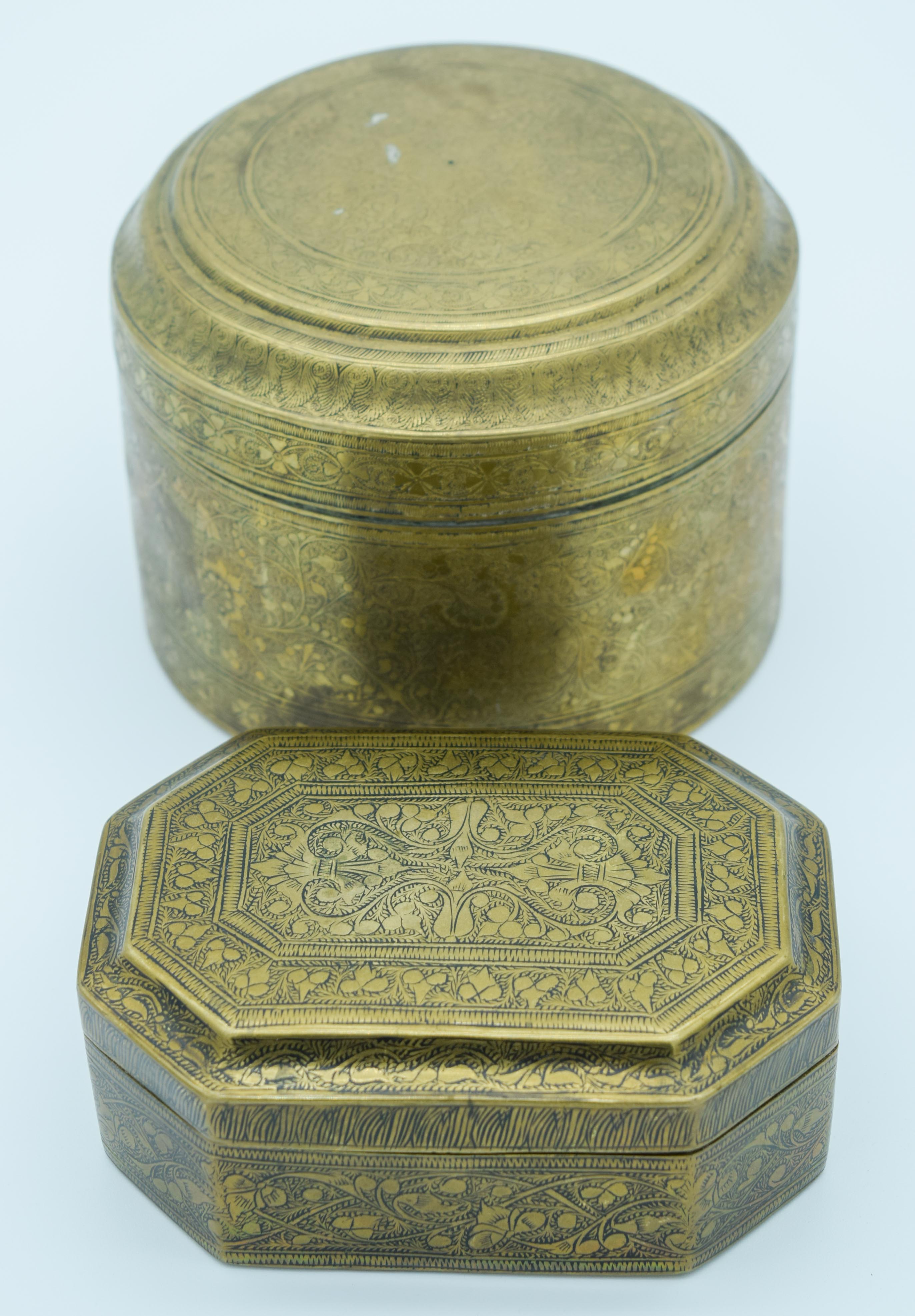 Two Indian 19th century engraved brass boxes largest 9.5cm x 13 cm. (2)