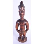 A FINE MALE IBEJI TWIN FIGURE modelled in the style of the Igbuke of Oyo. 27 cm high.