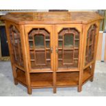 A Scottish veneered topped glass fronted display cabinet attribuited to Robert Lorimer.