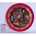 A LARGE 19TH CENTURY VIENNA PORCELAIN CIRCULAR DISH painted with figures within an interior. 40 cm d