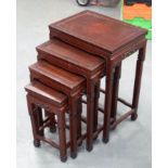 A NEST OF 19TH CENTURY CHINESE ROSEWOOD TABLES. Largest 70 cm x 40 cm. (4)