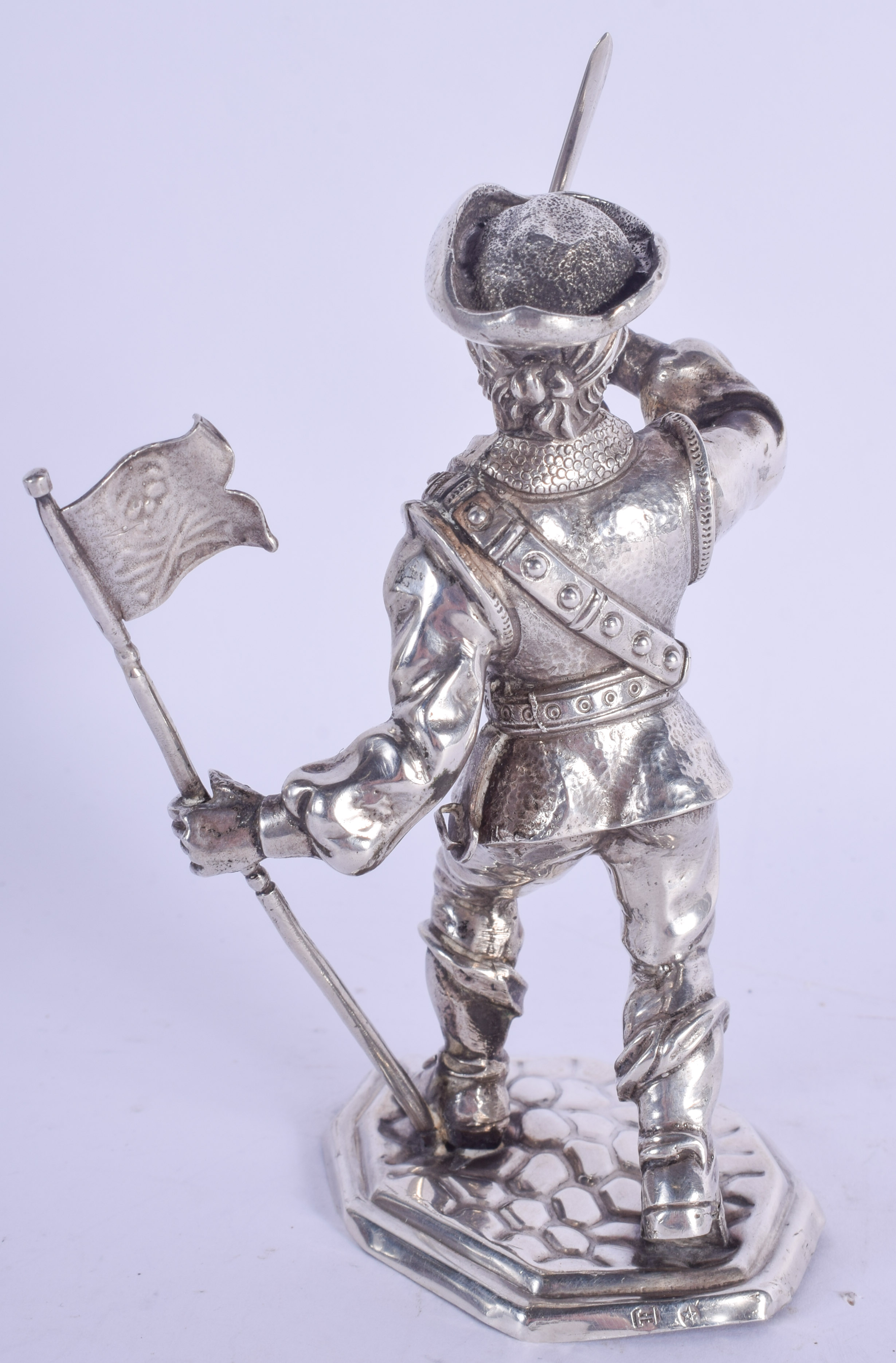 AN UNUSUAL EARLY 20TH CENTURY CONTINENTAL SILVER FIGURE OF A PIRATE modelled holding a flag. 150 gra - Image 2 of 4