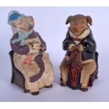 A PAIR ANTIQUE AUSTRIAN TOBACCO JAR AND COVER in the form of a pig and wolf. 17 cm high.