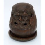 A Japanese small bronze figure of a grotesque head 12cm (2).