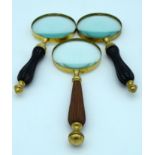 Three vintage magnifying glasses 26cm . (3)